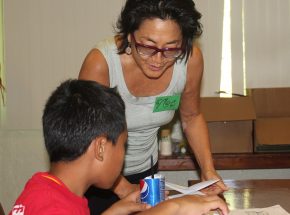 Artist Noe Tanigawa leads a Youth Mosaic workshop for students from George P. Harris and Koror Elementary schools.