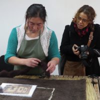 Alexis at her workshop with the Tumar Art Group looking at felt production.