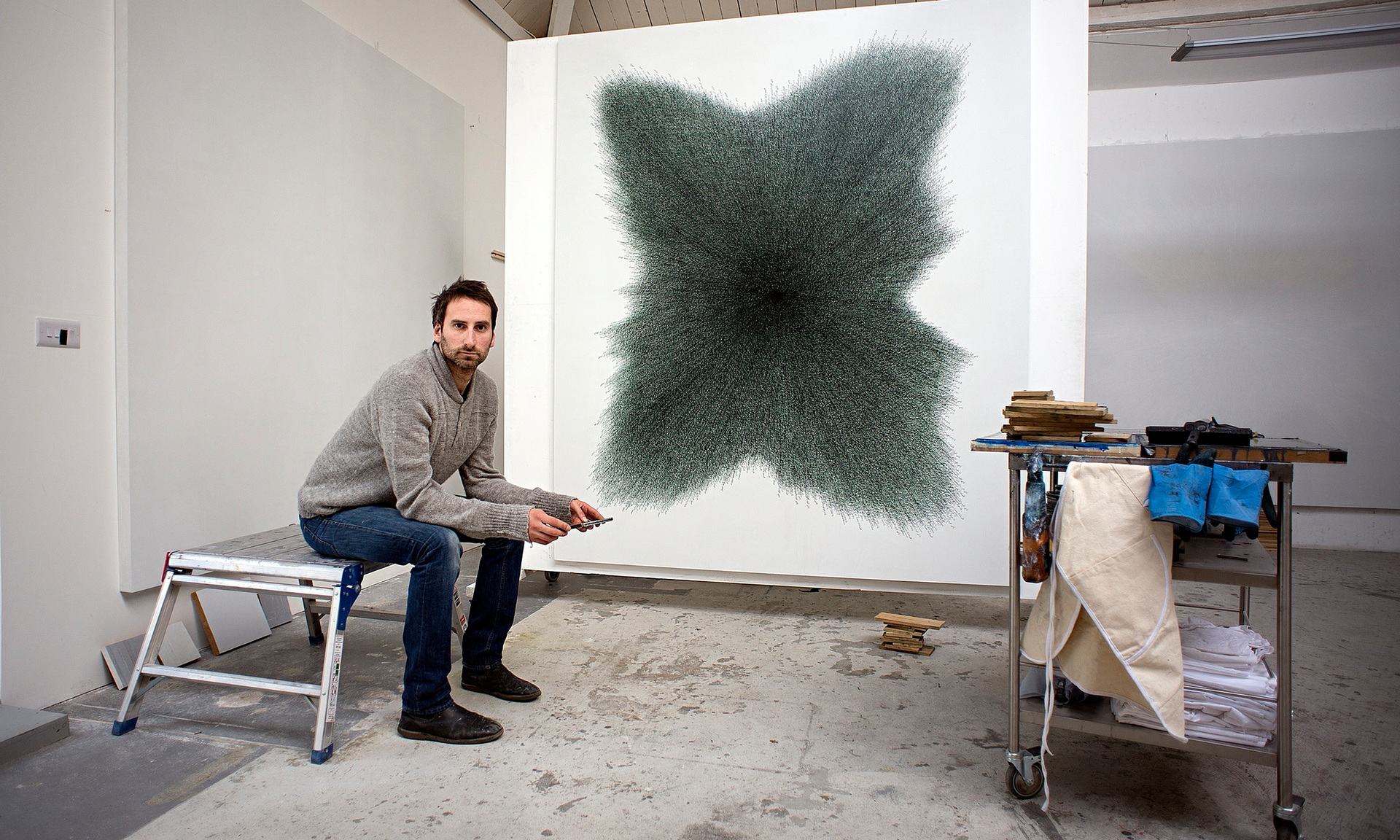 Idris Khan with his commissioned work for the U.S. Embassy Islamabad