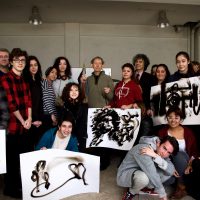 Local high school students and teachers pose with Dennis Lee Mitchell and their own ‘smoke drawings’ after a workshop at OSTIM in Ankara.