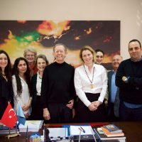 After the talk, students and members of the faculty at Gazi University pose with Dennis Lee Mitchell.