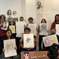 Artist Arely Morales leads a workshop for young students where they learned the foundations of self-portraiture and its potential for self-expression.